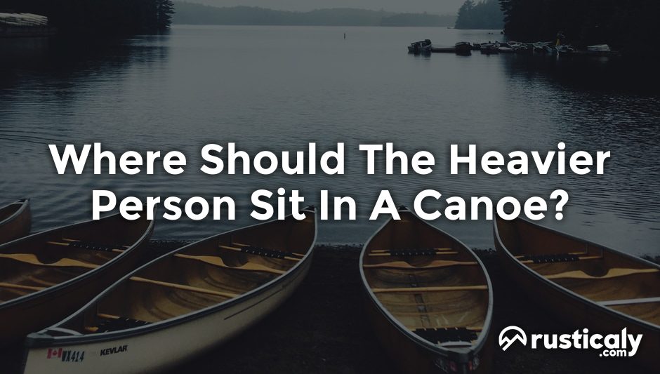 where should the heavier person sit in a canoe